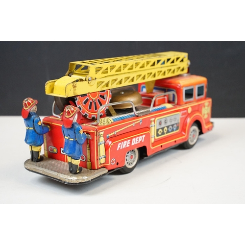 415 - Two fire engine models to include boxed tin plate ME 699 Battery Operated Fire Chief and tin plate f... 