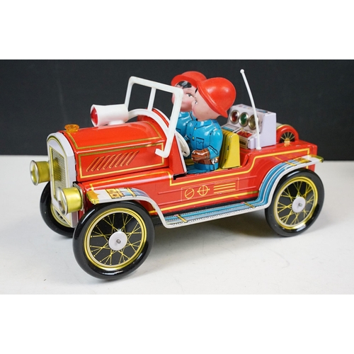 415 - Two fire engine models to include boxed tin plate ME 699 Battery Operated Fire Chief and tin plate f... 