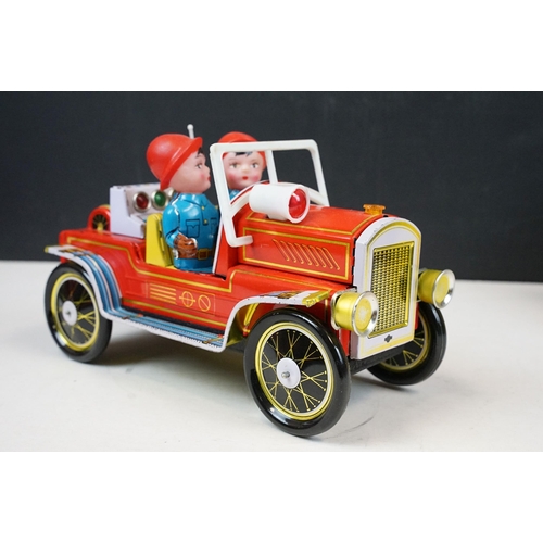 415 - Two fire engine models to include boxed tin plate ME 699 Battery Operated Fire Chief and tin plate f... 