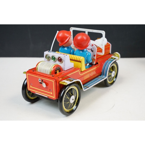 415 - Two fire engine models to include boxed tin plate ME 699 Battery Operated Fire Chief and tin plate f... 