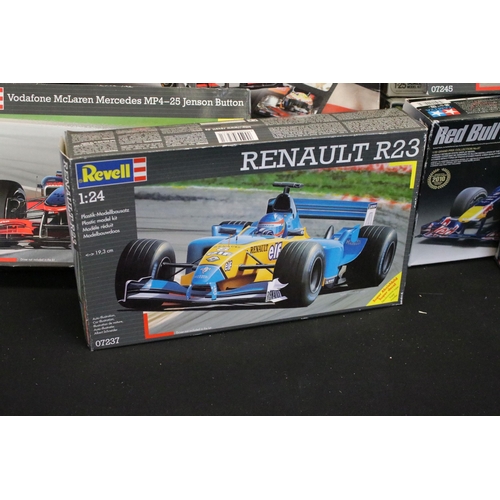 336 - 15 Boxed racing related plastic model kits of varying scales to include 1/24 Revell Vodafone Mclaren... 