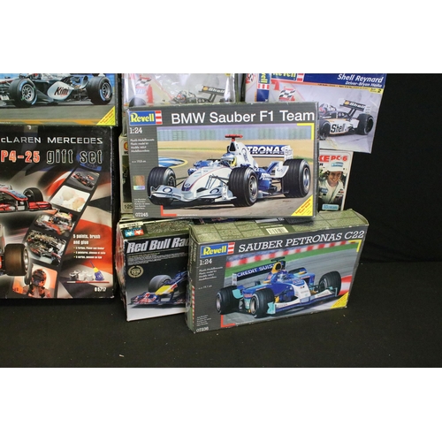 336 - 15 Boxed racing related plastic model kits of varying scales to include 1/24 Revell Vodafone Mclaren... 