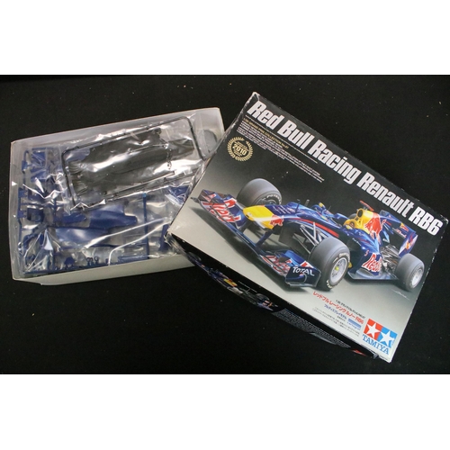 336 - 15 Boxed racing related plastic model kits of varying scales to include 1/24 Revell Vodafone Mclaren... 