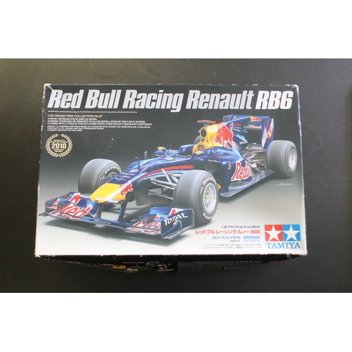 336 - 15 Boxed racing related plastic model kits of varying scales to include 1/24 Revell Vodafone Mclaren... 