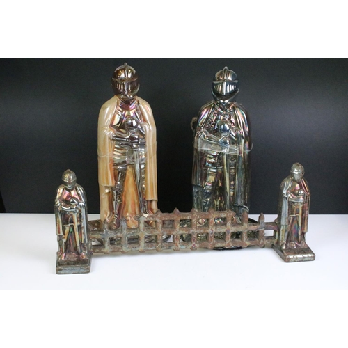 130 - Fire companion set, comprising: fire guard of small proportions, flanked by knights, 19cm high x 50c... 