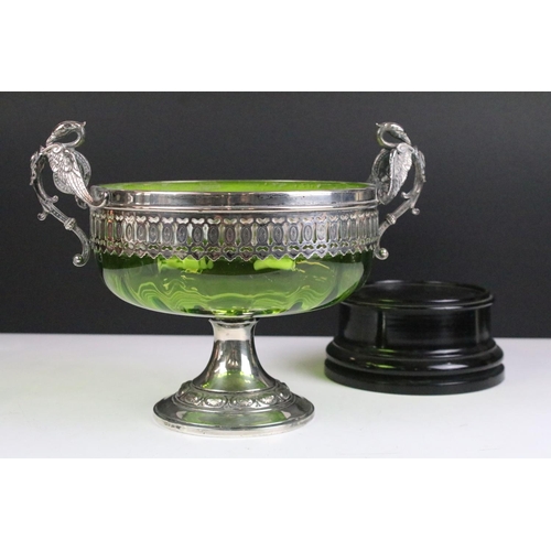 148 - WMF silver plate & green glass footed bowl with twin handles modelled as swans, raised on an ebonise... 