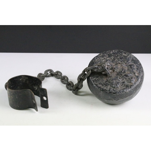 153 - 19th Century ball and chain with ankle cuff. Measures 75cm wide.