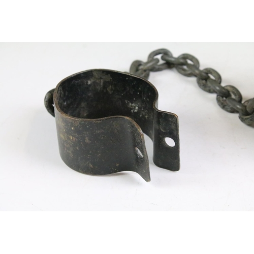 153 - 19th Century ball and chain with ankle cuff. Measures 75cm wide.