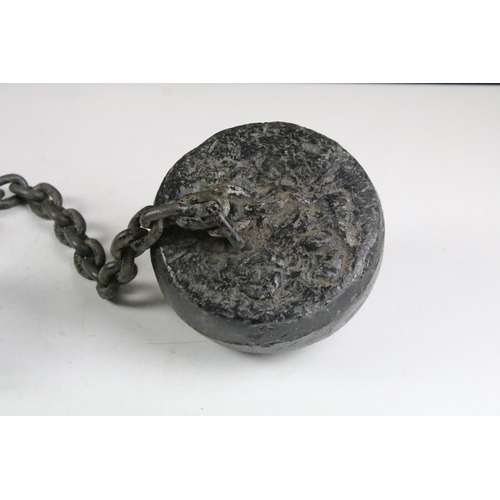 153 - 19th Century ball and chain with ankle cuff. Measures 75cm wide.