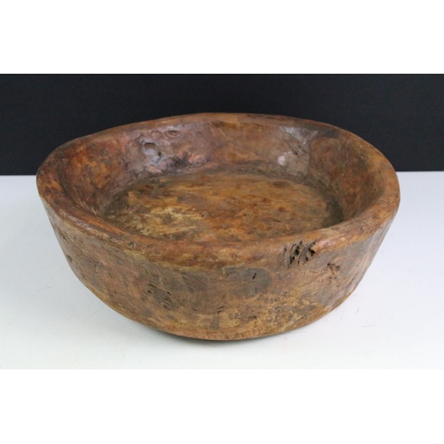 163 - Rustic antique carved wooden bowl of circular form, approx 36cm diameter