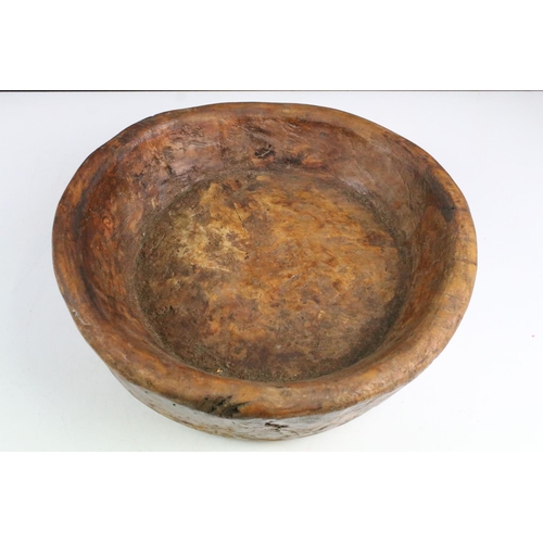 163 - Rustic antique carved wooden bowl of circular form, approx 36cm diameter