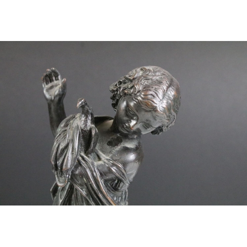 166 - 19th Century Cast bronze figurine in the form of a classical female holding a dove raised on a turne... 