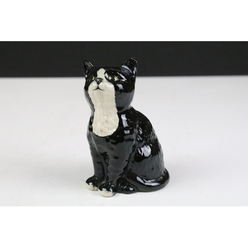 82 - Collection of ceramic figurines to include four Beswick cat figurines, a Beswick Mr Jeremy Fisher, a... 