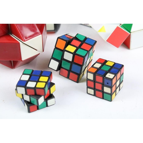 A collection of mixed Rubik's cube and puzzle cubes.