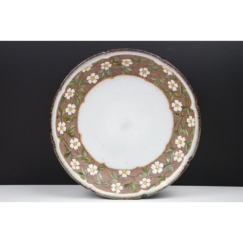 20 - Japanese studio pottery bowl of circular form, the border decorated with white & yellow flowers, stu... 