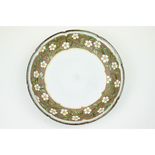 20 - Japanese studio pottery bowl of circular form, the border decorated with white & yellow flowers, stu... 