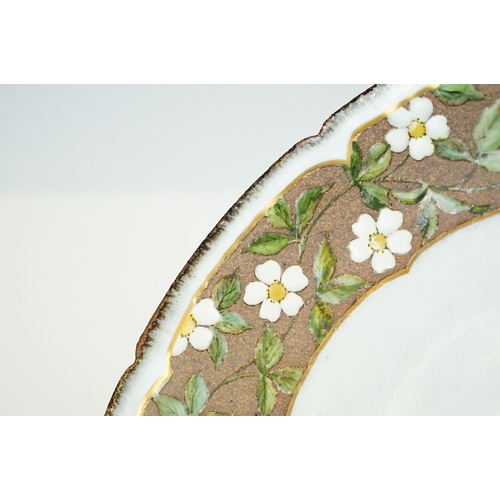 20 - Japanese studio pottery bowl of circular form, the border decorated with white & yellow flowers, stu... 