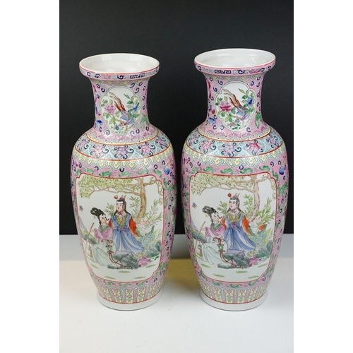 31 - Pair of Chinese famille jaune vases of baluster form decorated with panels depicting two Chinese fig... 