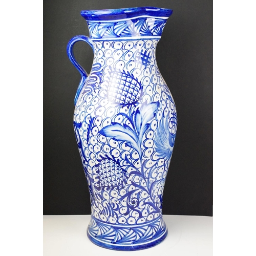 47 - Large blue & white floor standing ceramic jug vase with foliate decoration on a repeating ground, ap... 