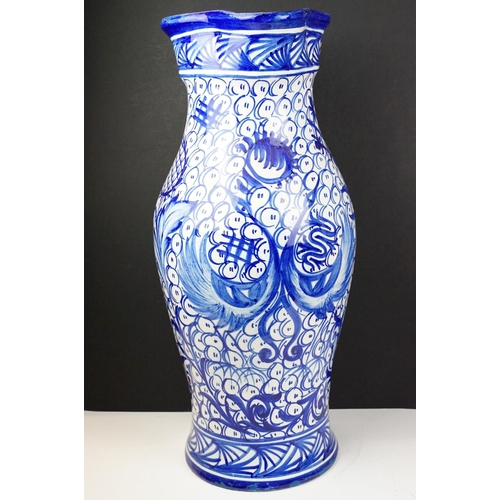 47 - Large blue & white floor standing ceramic jug vase with foliate decoration on a repeating ground, ap... 