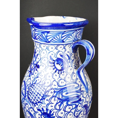 47 - Large blue & white floor standing ceramic jug vase with foliate decoration on a repeating ground, ap... 