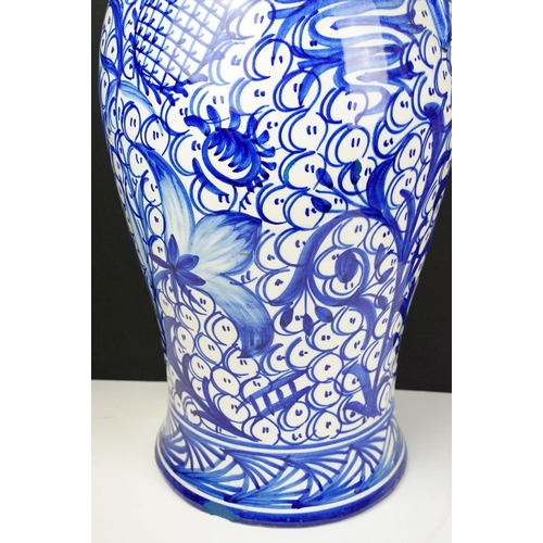 47 - Large blue & white floor standing ceramic jug vase with foliate decoration on a repeating ground, ap... 