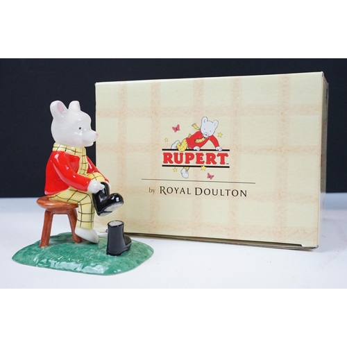 49 - Collection of Royal Doulton Rupert figurines in original boxes. Lot includes nine bears in total.