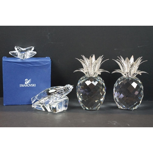 56 - Collection of Swarovski, comprising: two pineapples, 11cm high, group of two seals resting on a rock... 