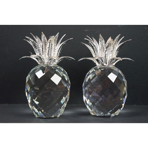 56 - Collection of Swarovski, comprising: two pineapples, 11cm high, group of two seals resting on a rock... 