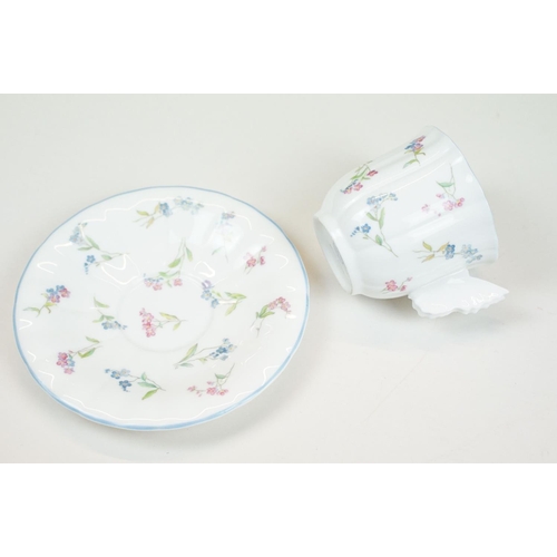 58 - Two Paragon floral teacups & saucers with black ground floral decoration, to include a blue and yell... 