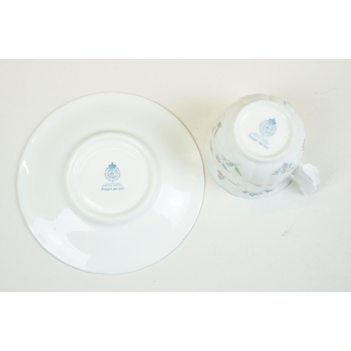 58 - Two Paragon floral teacups & saucers with black ground floral decoration, to include a blue and yell... 