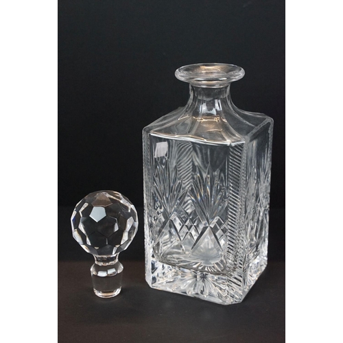 6 - Two crystal glass decanters of square form with stoppers, with two silver hallmarked decanter labels... 