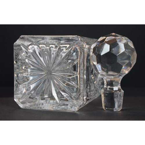 6 - Two crystal glass decanters of square form with stoppers, with two silver hallmarked decanter labels... 