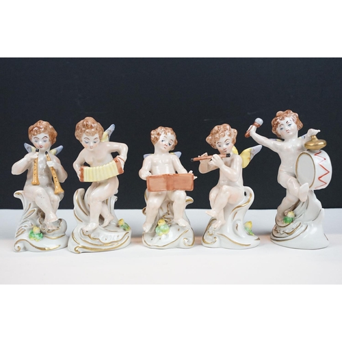 60 - German porcelain five piece band of cherubs / putti with gilt detail, printed marks to bases, approx... 