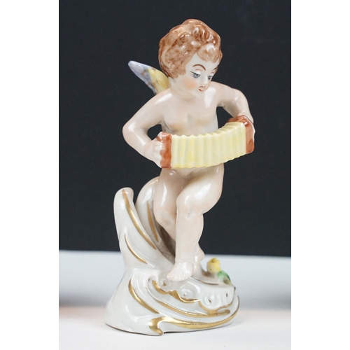 60 - German porcelain five piece band of cherubs / putti with gilt detail, printed marks to bases, approx... 