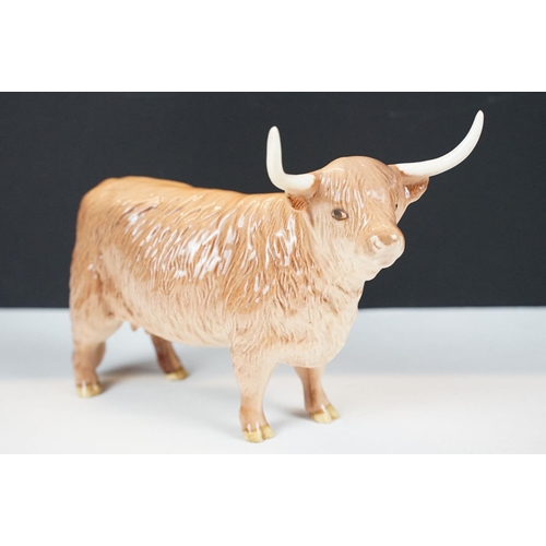 73 - Beswick Limousin bull in brown gloss (BOC 1998, approx 12cm tall), together with a Beswick Highland ... 