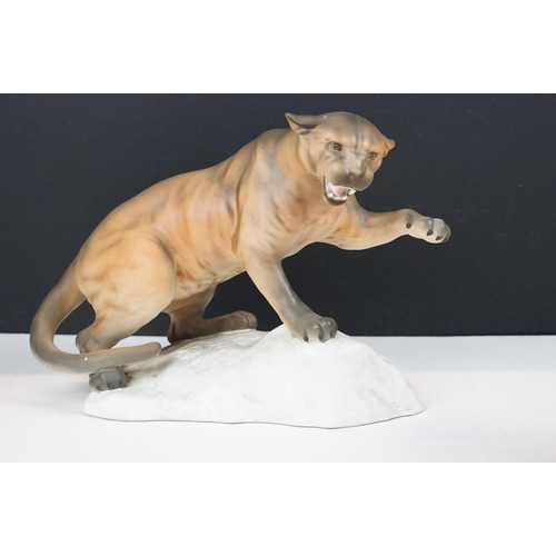 74 - Two matt glaze Beswick figurines of a lion and a mountain cat (numbered 1702, approx 20.5cm tall)