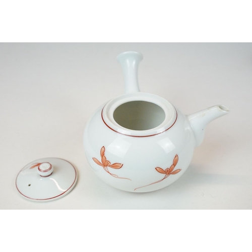 75 - Japanese porcelain part tea set comprising teapot, milk jug and five cups, together with five fan sh... 