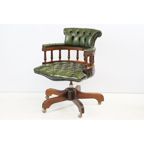 709 - 20th century mahogany captain's swivel desk / office chair, with green leatherette studded button ba... 