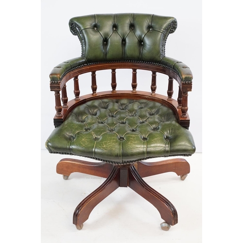 709 - 20th century mahogany captain's swivel desk / office chair, with green leatherette studded button ba... 