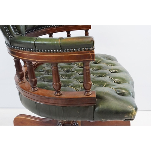 709 - 20th century mahogany captain's swivel desk / office chair, with green leatherette studded button ba... 