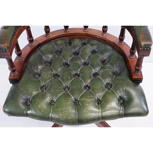709 - 20th century mahogany captain's swivel desk / office chair, with green leatherette studded button ba... 