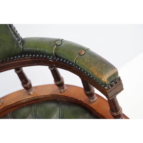 709 - 20th century mahogany captain's swivel desk / office chair, with green leatherette studded button ba... 