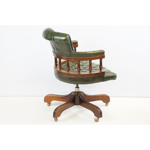 709 - 20th century mahogany captain's swivel desk / office chair, with green leatherette studded button ba... 