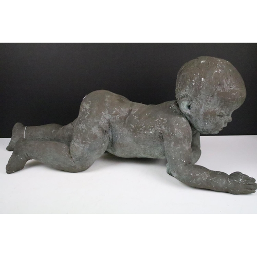 157 - 20th Century cast resin bronzed baby figurine depicted crawling. Measures 70cm wide.