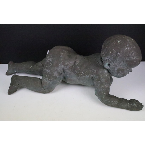 157 - 20th Century cast resin bronzed baby figurine depicted crawling. Measures 70cm wide.