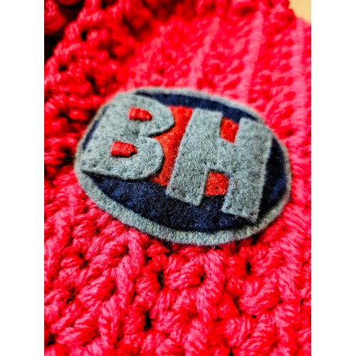 72 - A miniature red Bargain Hunt jacket (approx. for a one year old) hand-crocheted and appliquéd by Bar... 