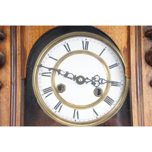 106 - Early 20th century Vienna pendulum wall clock, the enameled face with Roman numerals to the chapter ... 