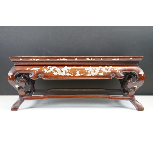 109 - Chinese small hardwood table top stand of rectangular form, with mother of pearl inlaid dragon decor... 