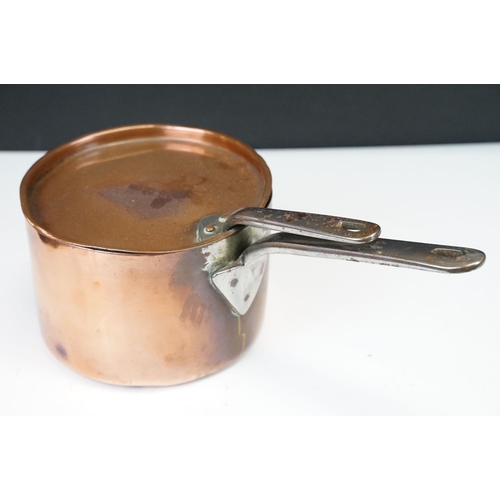 111 - Graduating set of six copper saucepans with brass handled, together with a larger saucepan & cover (... 